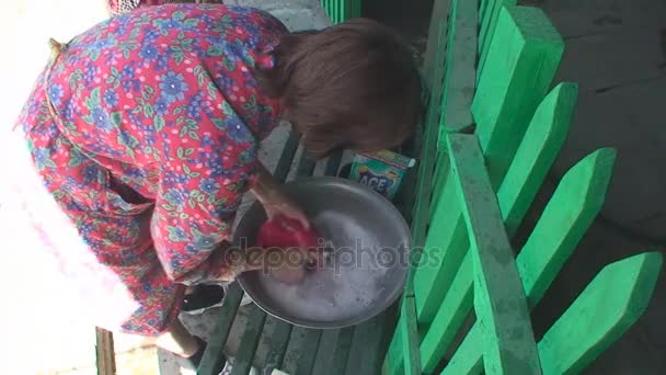 A woman washes clothes by hands — Stock Video