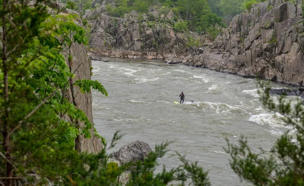 Man on Kayak in wetsuit on kayak on the river