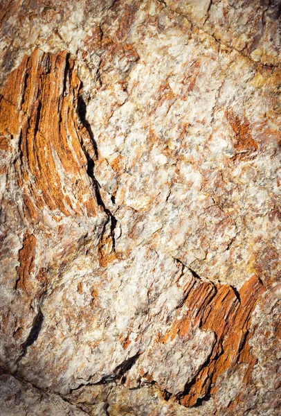Detail mica rotsen van oker en oranje kleur — Stockfoto