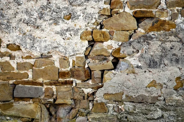Деталь кам'яна стіна з гіпсовою підлогою — стокове фото
