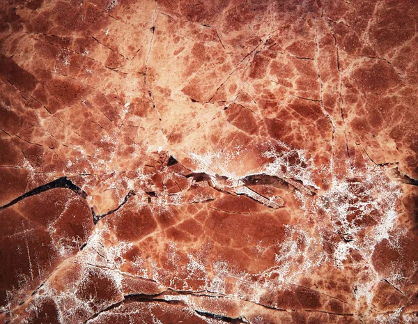 crack on red marble