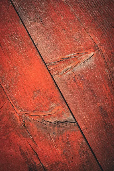 Detalle de una tabla de madera con pintura roja —  Fotos de Stock