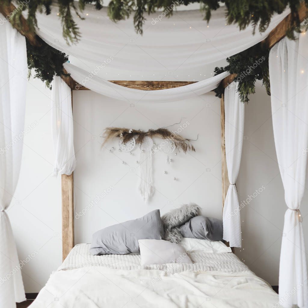 Modern home interior design. Bed with pillows, blanket. Bedroom interior, scandinavian style. Home decor. 