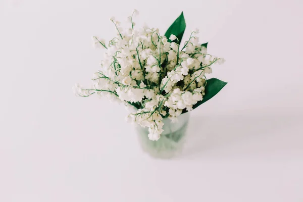 Bouquet of lilies of the valley on white background. Holiday, birthday, Easter, International Womens Day concept. Feminine flatlay — Stock Photo, Image