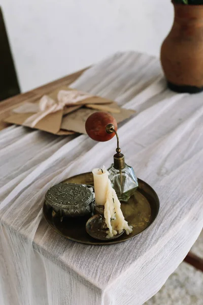 Tray with candle, perfume, jewelry box on  dressing table. Girl accessories. interior design