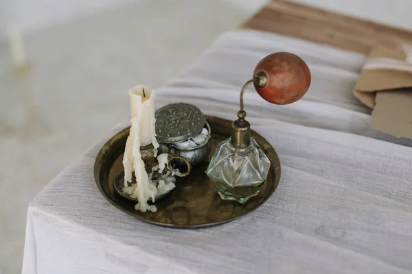 Tray with candle, perfume, jewelry box on  dressing table. Girl accessories. interior design