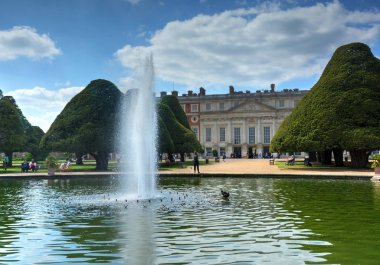 East Molesey, UK - May 26, 2015 - A view of Hampton Court Palace, a royal palace in the borough of Richmond upon Thames, London, England. clipart