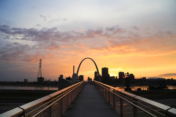 Sunset over the Gateway Arch and St. Louis, Missouri.