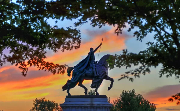 The sunset over the Apotheosis of St. Louis statue of King Louis IX of France, namesake of St. Louis, Missouri in Forest Park, St. Louis, Missouri.