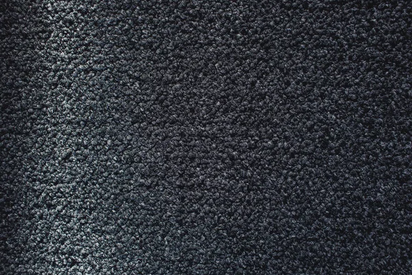 Промінь світла на сірій килимовій текстурі — стокове фото