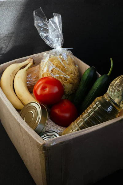 Food delivery box for breakfast. Food delivery from markets and restaurants. Meal for a week on quarantine. Fresh vegetables, fruits at the craft box. Contactless food delivery