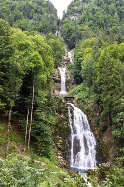 Giessbachfall waterfall near Brienz in Switzerland in Alps clipart