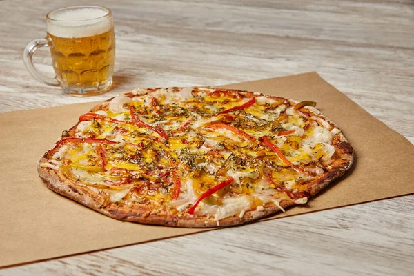 Vegan pizza with beer