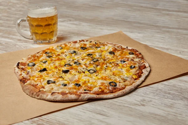 Vegan pizza with beer