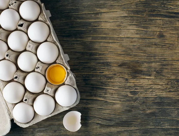 White raw chicken eggs in carton box — Stock Photo, Image