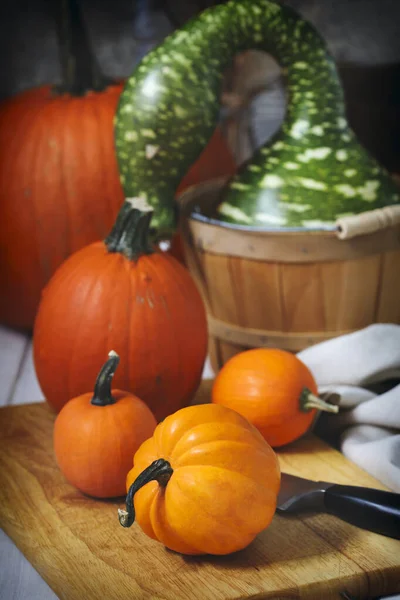 Assorted pumpkin on wooden table — Stock Photo, Image