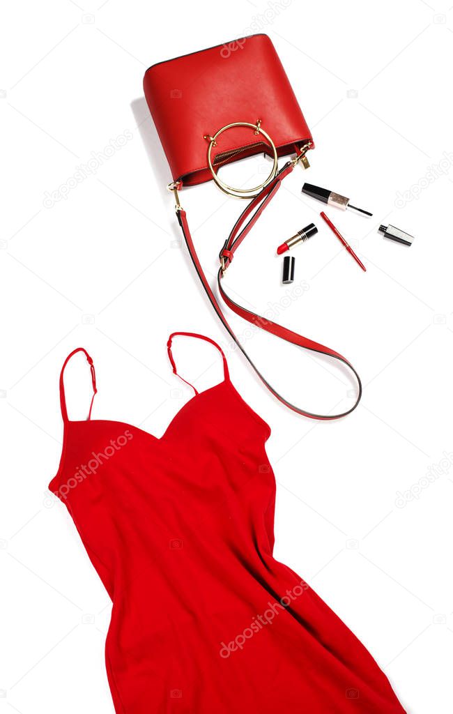 Women's red dress and handbag with cosmetics. Fashion concept