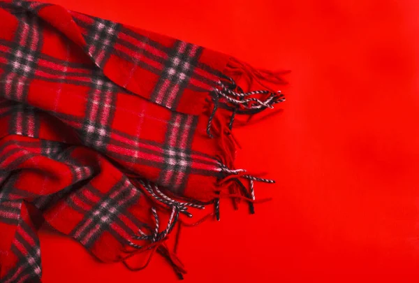 Red scarf on red background, copy space — Stock Photo, Image