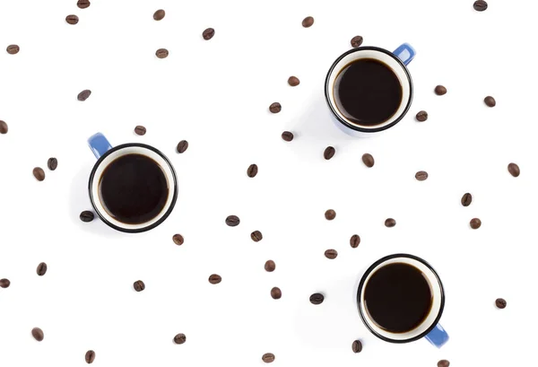 Cups of black coffee, top view.