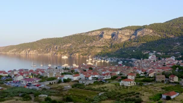 Aerial view of Komiza on Vis island, Croatia in Dalmatia at sunrise. — Stock Video