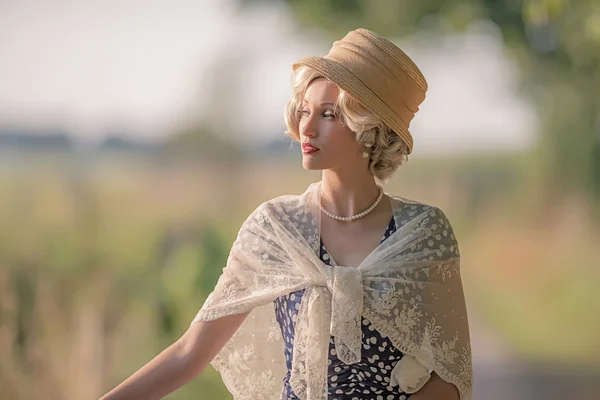 Vintage woman in rural landscape — Stock Photo, Image