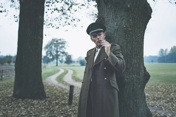 Military officer smoking cigarette — Stock Photo, Image