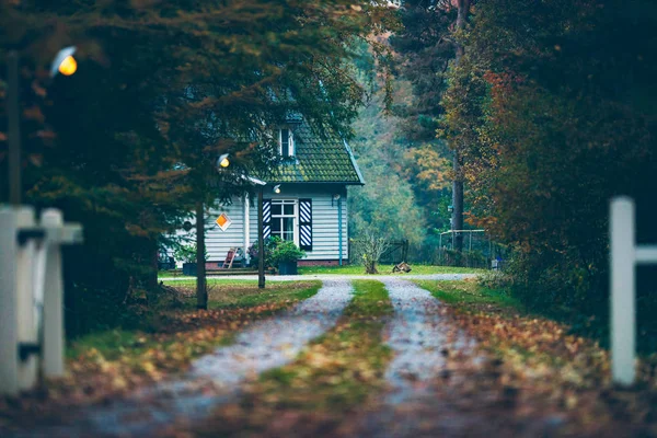 House in autumn forest — Stock Photo, Image