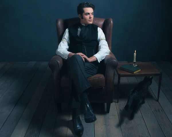 Victorian man sitting on leather chair
