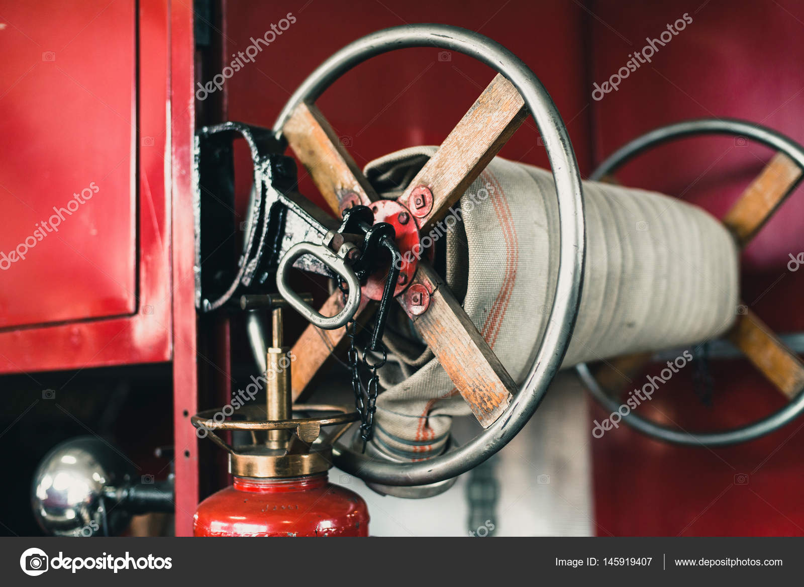 Close-up of coiled fire hose Stock Photo by ©ysbrand 145919407