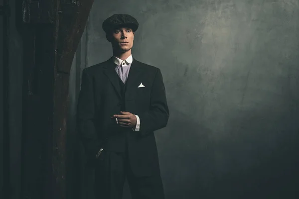 Gangster standing with cigarette — Stock Photo, Image