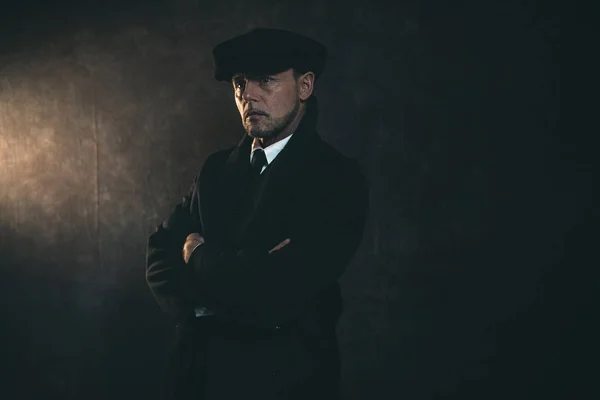 Gangster wearing in coat and in flat cap — Stock Photo, Image