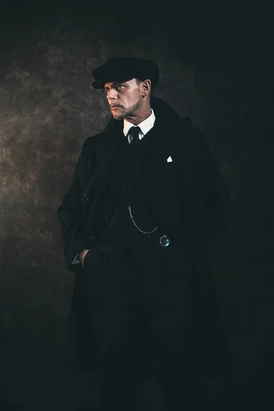 Gangster wearing in coat and in flat cap — Stock Photo, Image