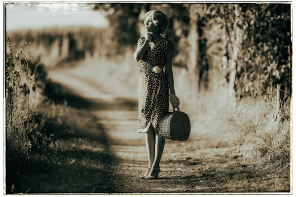 Fashion woman with handbag on road — Stock Photo, Image