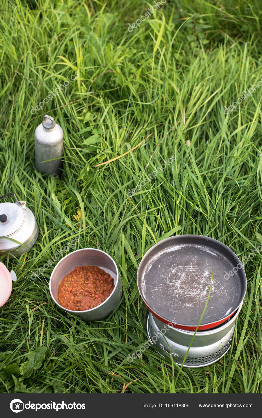 Camping stove with saucepan Stock Photo by ©ysbrand 166118306