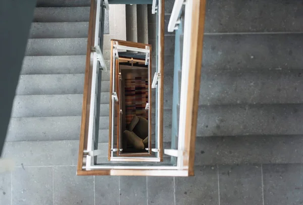 Industrial stairwell with armchair — Stock Photo, Image