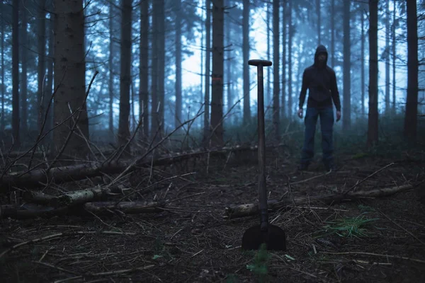 Shovel and man in misty forest — Stock Photo, Image