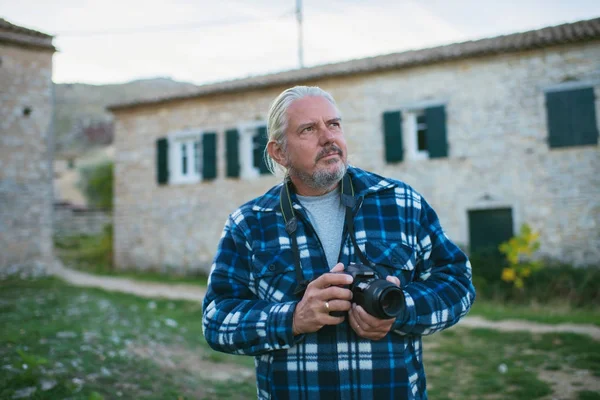 Photographer in ghost town Old Perithia