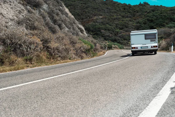 Motorhome driving on mountain road — Stock Photo, Image
