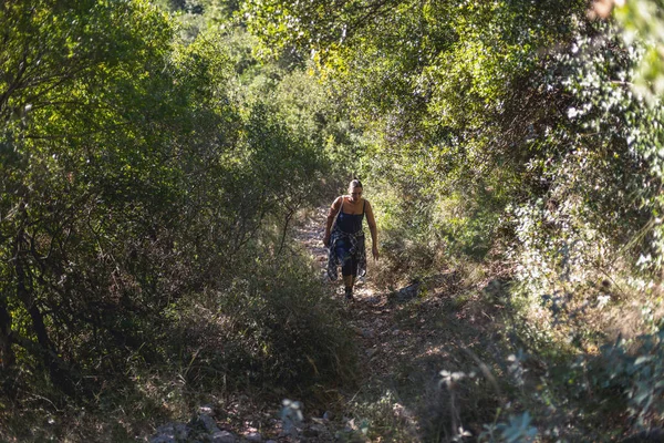 Woman walking uphill