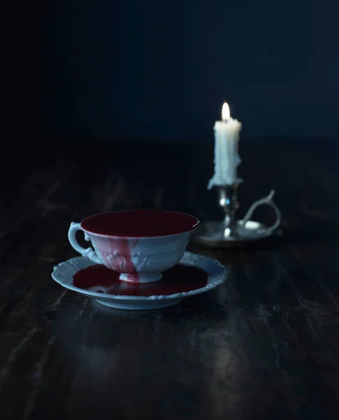 White Tea Cup Filled Blood Burning Candle Candleholder Dark Wooden — Stock Photo, Image