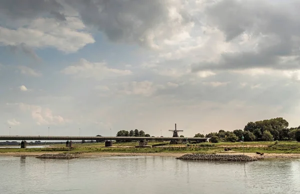 River IJssel with bridge and windmill — Stock Photo, Image