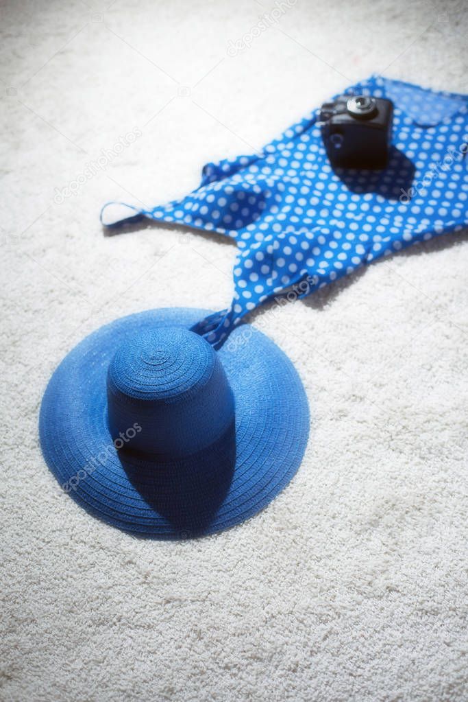 Blue hat with swimsuit and camera