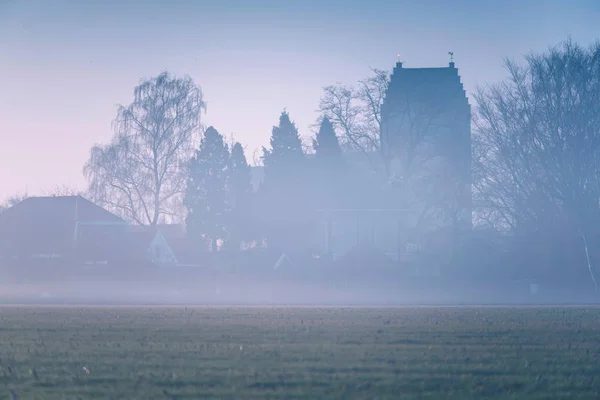 Silhouette of church, house and trees — Stock Photo, Image