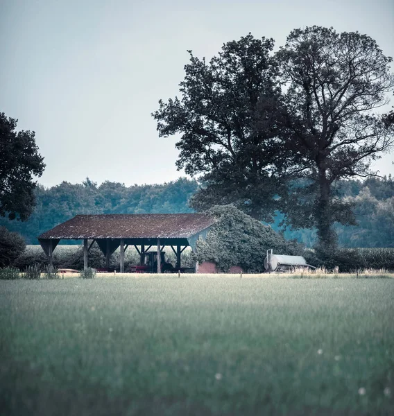 Old shed with tractor — Stock Photo, Image