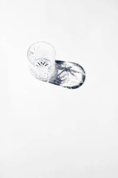 Vintage empty whiskey glass on white background. — Stock Photo, Image