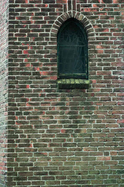 Window in brick wall of church. — Stock Photo, Image