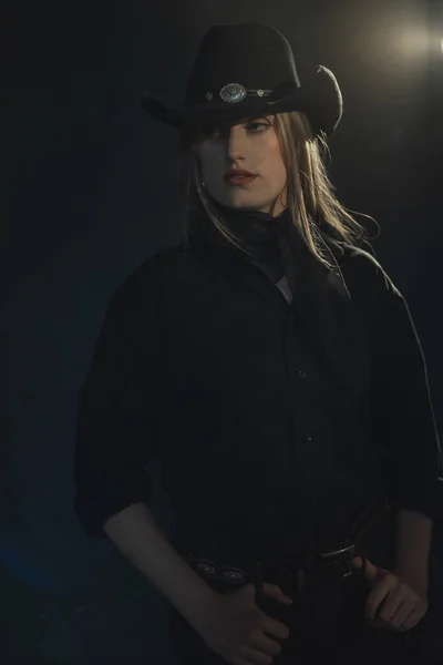 Blonde cowgirl in black shirt and hat. — Stock Photo, Image