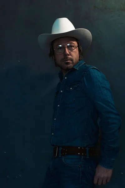 Man Denim Shirt Cowboy Hat Eyeglasses Standing Grey Wall — Stock Photo, Image