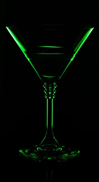 Silhouette glasses with drink in bar on black background — Stock Photo, Image