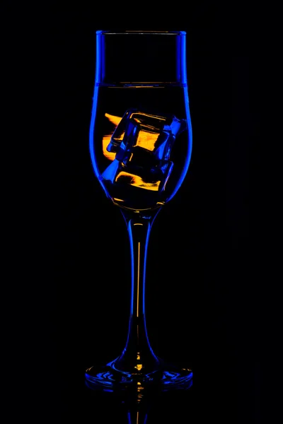 Silhouette glasses with drink in bar on black background — Stock Photo, Image